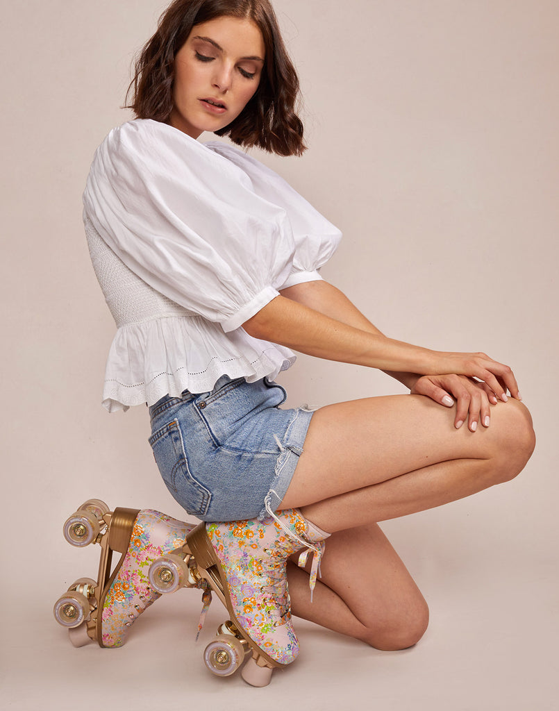 Alternate close up side view model wearing Cynthia Rowley x Impala Floral Rollerskates