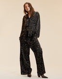 Black silk lounge pants in a pill print