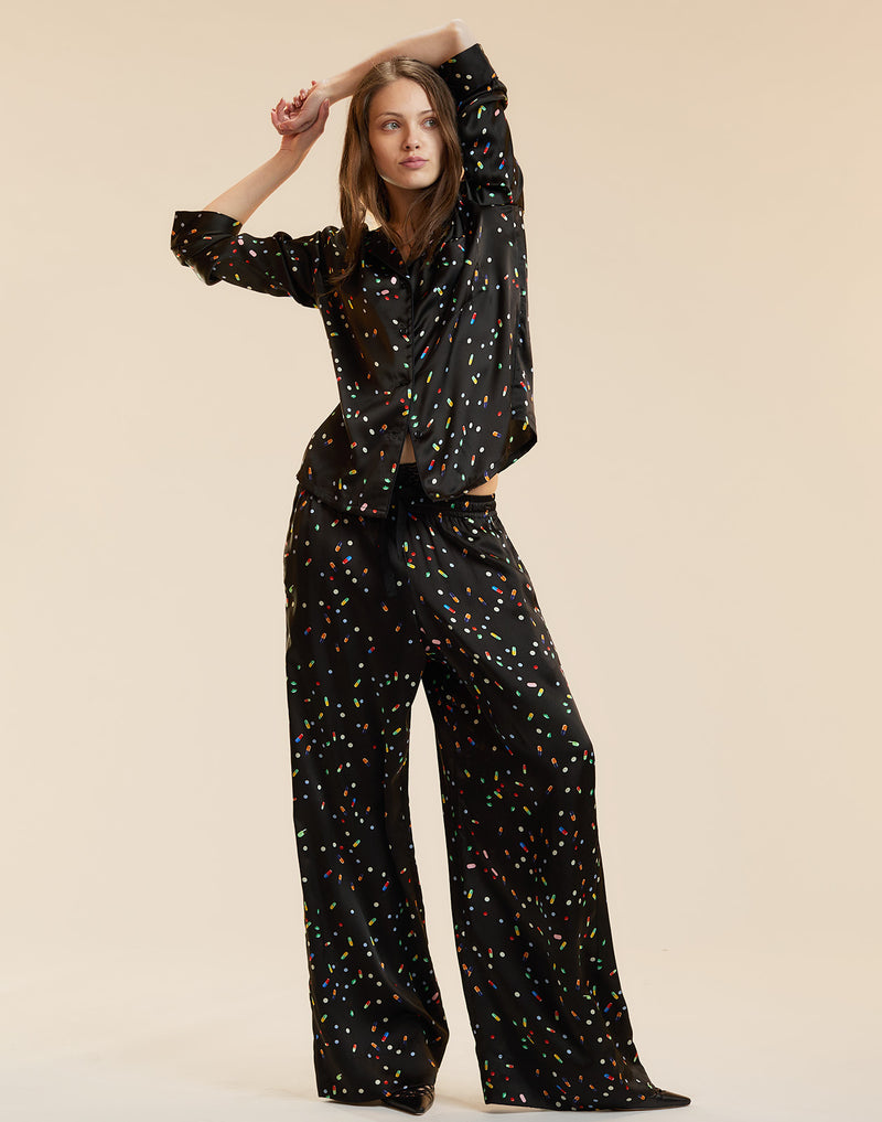 Black silk lounge pants in a pill print