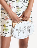 White laser cut purse