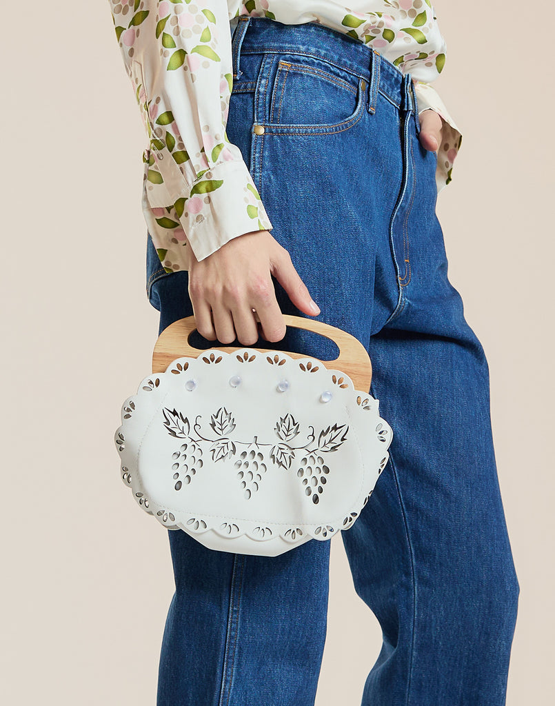 White laser cut purse